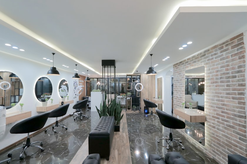 Bright modern barbershop floor with mirrors and stations