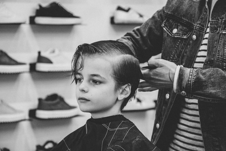 Young boy getting a clean haircut from a barber
